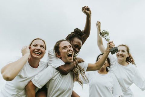 female-football-players-celebrating-their-victory.jpg